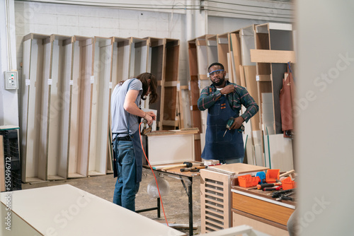 Carpenter working on the woodworking desk and furniture handmade with wood