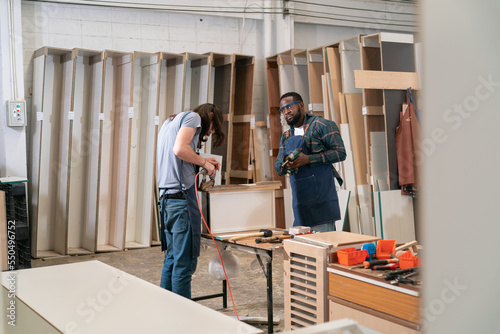 Carpenter working on the woodworking desk and furniture handmade with wood