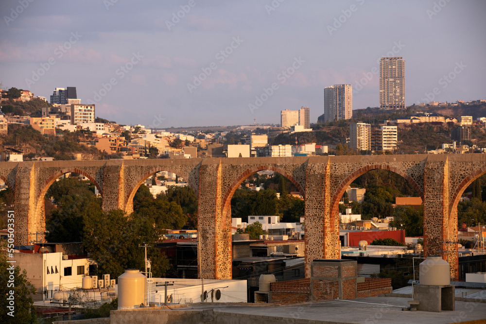 Sunset view of colonial architecture and contemporary skyline of downtown Santiago de Querétaro, Mexico.