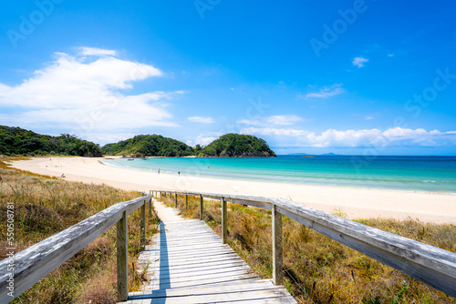 Matapouri Beach in Summer with glowing clear water at Northland, New Zealand