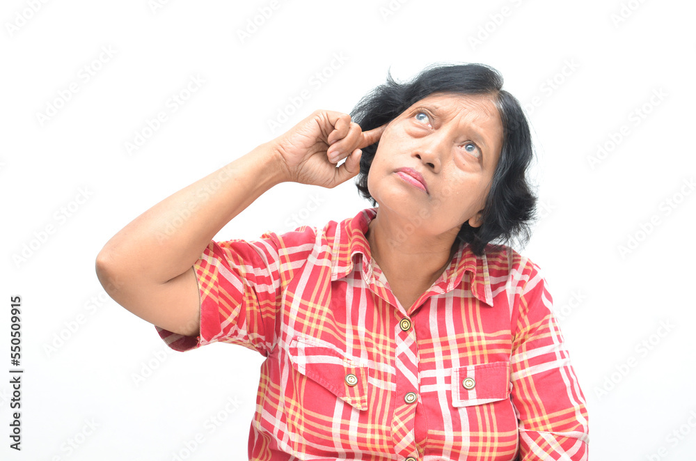 thoughtful concerned asian mature woman thinking and wondering with hand gesture thoughtful concerned asian mature woman thinking and wondering with hand gesture