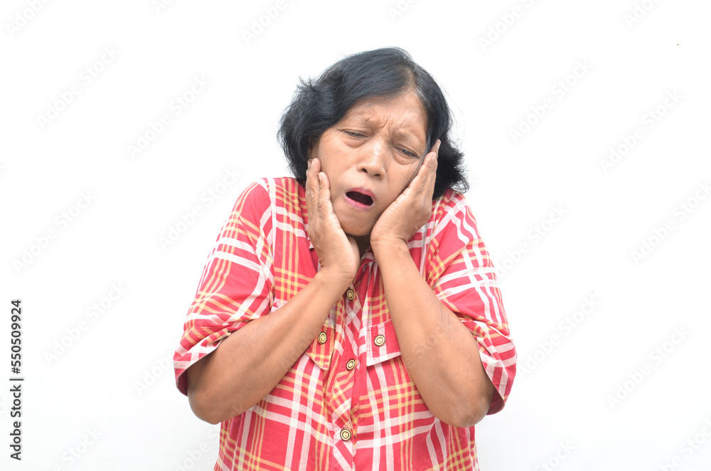 old senior asian woman touching cheeck suffering from toothache old senior asian woman touching cheeck suffering from toothache
