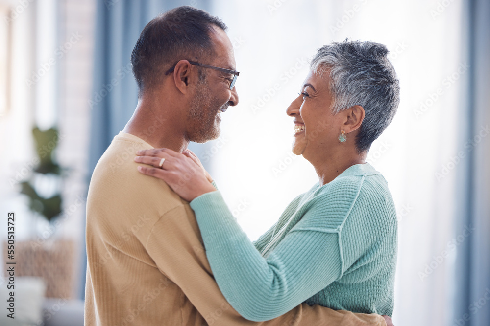 Happy, love and romance with a senior couple laughing, hugging or dancing together in their home. Dance, romantic and smile with a happy mature man and woman enjoying their retirement while bonding Happy, love and romance with a senior couple laughing, hugging or dancing together in their home. Dance, romantic and smile with a happy mature man and woman enjoying their retirement while bonding