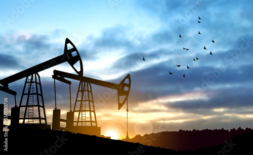 Oil pump. Industrial machine for petroleum on background of sunset