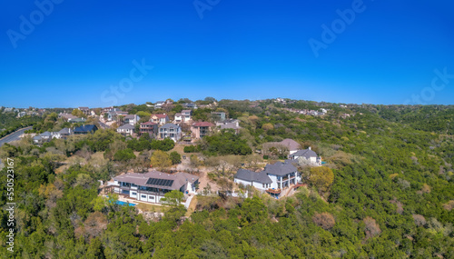 Austin, Texas-Mansions and villas on top of a mountain in aerial view © Jason