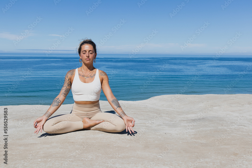 meditating on the beach Gyan Mudra hands meditating on the beach Gyan Mudra hands