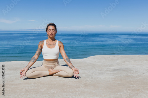 meditating on the beach Gyan Mudra hands