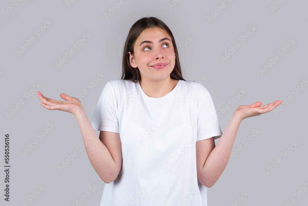 Confused beautiful woman with questioning gesture. Girl shrugging shoulders, doubts. Confused beautiful woman with questioning gesture. Girl shrugging shoulders, doubts.