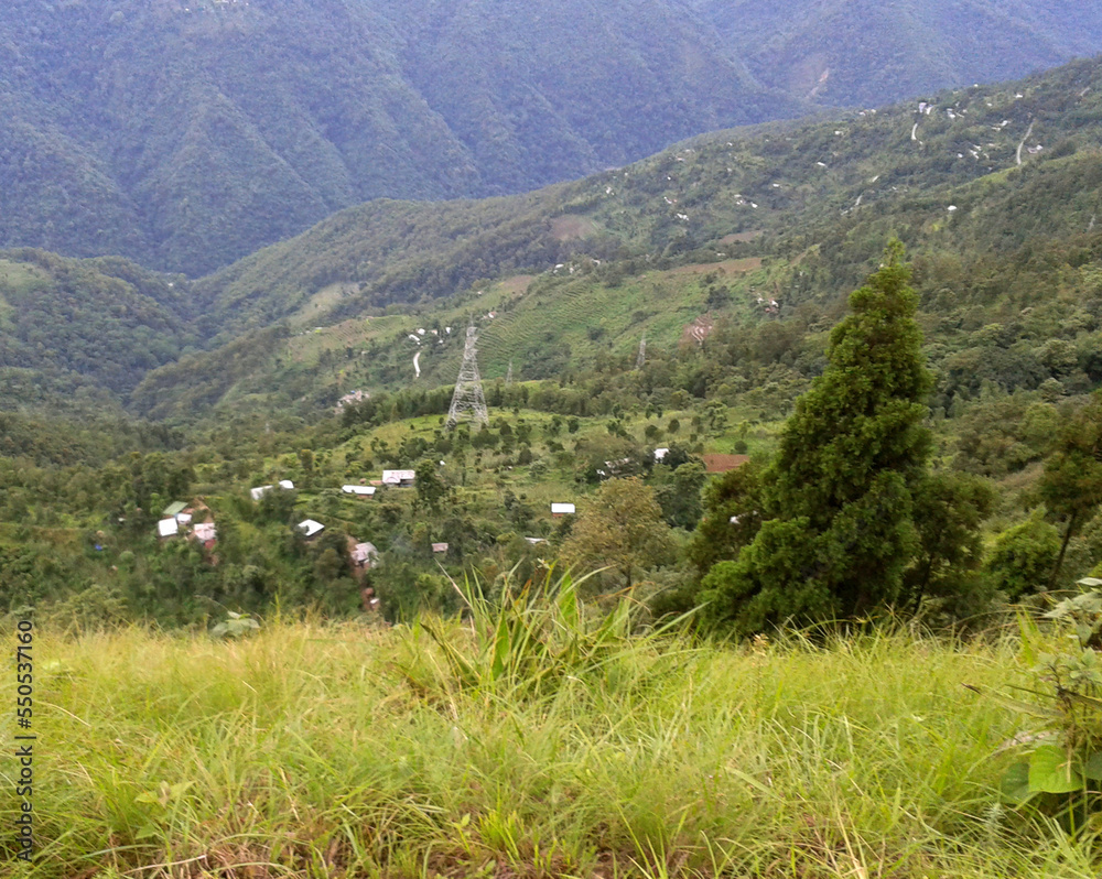 A panoramic view of verdant green Melli Dara village looks mesmerizing from Tarey Bhir in Sadam, South Sikkim.