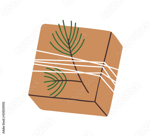 Christmas gift box in kraft brown paper with fir branch decor. Xmas, winter h...
