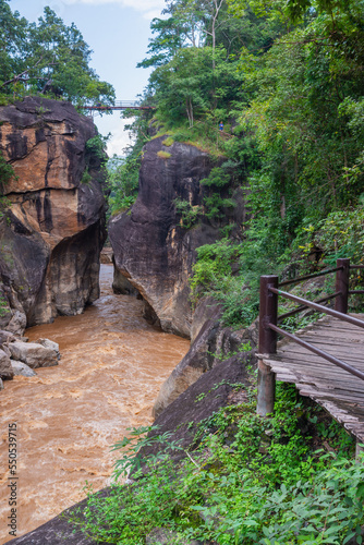 Beautiful view from small iron bridge over Op Luang Canyon and fast-flowing river in Op Luang National Park, Chiang Mai, Thailand.