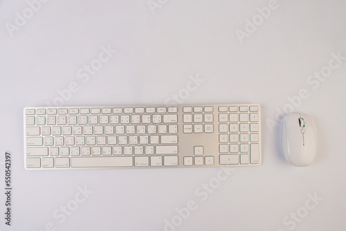 Wireless computer keyboard and mouse on white background