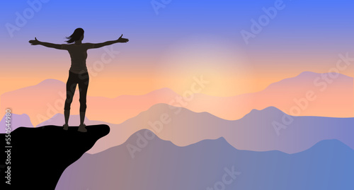 A young woman silhouette against sunset with arms up in sky feeling free and happy. Freedom, and joy concept © Natwaree