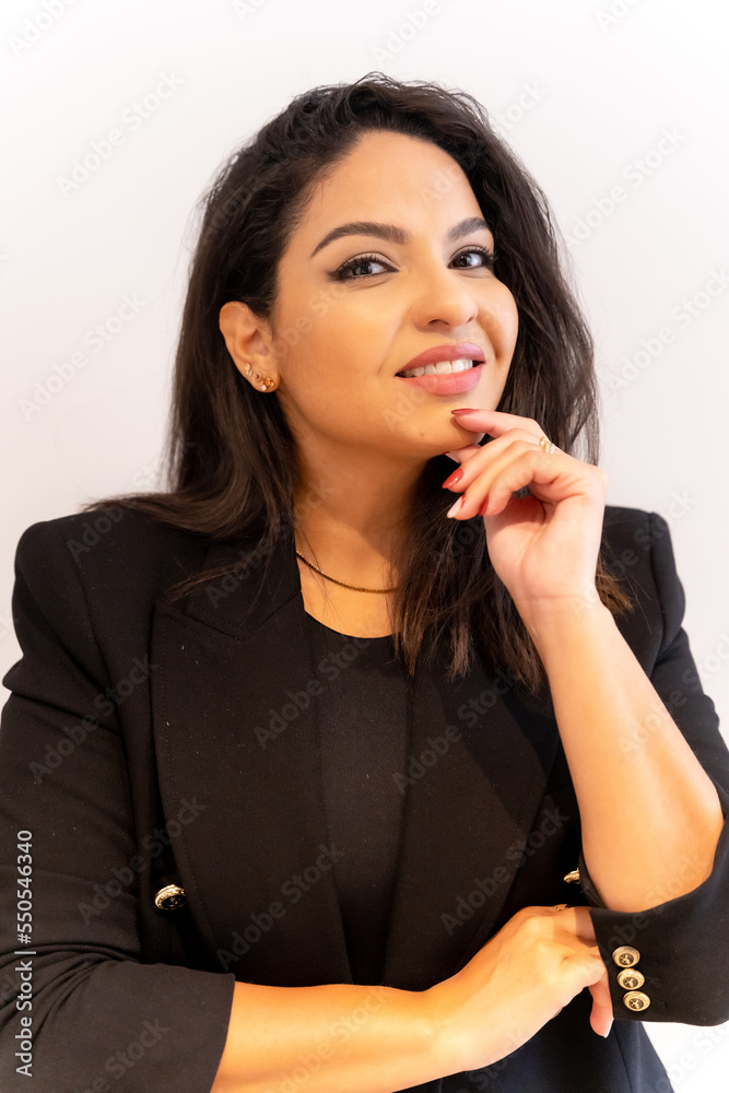 Woman of Latin ethnicity in an aesthetic store of eyebrows and nails. Portrait of female boss on white background Woman of Latin ethnicity in an aesthetic store of eyebrows and nails. Portrait of female boss on white background