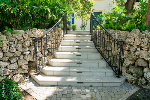 Outdoor stairs with floor-mounted handrails near the stone walls at Miami, Florida