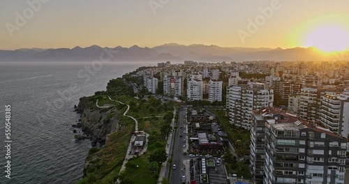 Antalya Turkey Aerial v21 low flyover coastal park capturing cityscape across çağlayan and güzeloba with lower düden waterfall pouring off rocky cliff at sunset - Shot with Mavic 3 Cine - July 2022 photo