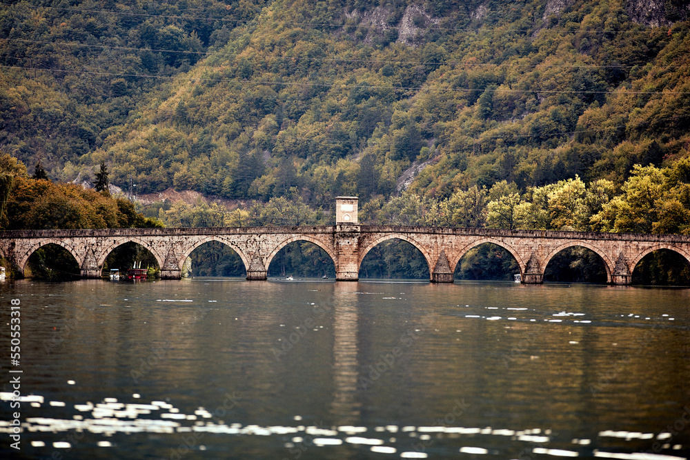 Fototapeta premium Bridge on river Drina, famous historic Ottoman architecture in Visegrad, Bosnia and Herzegovina.