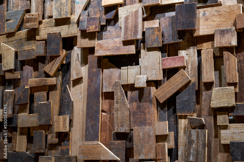 Timber planks covering a wall in a carpenter's shop