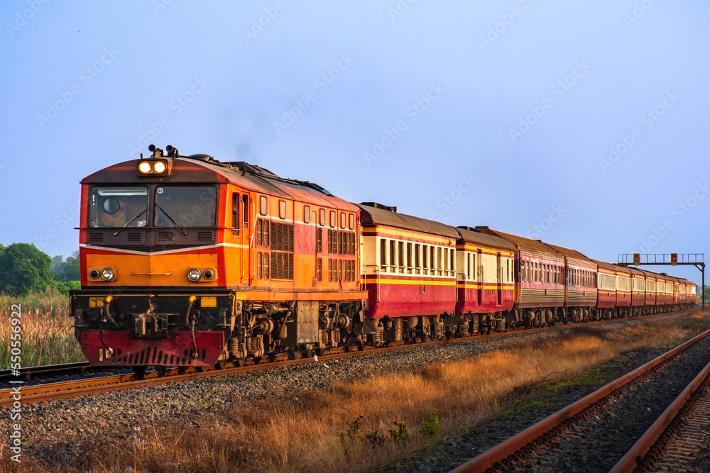 Passenger train by diesel locomotive on the railway. Passenger train by diesel locomotive on the railway.