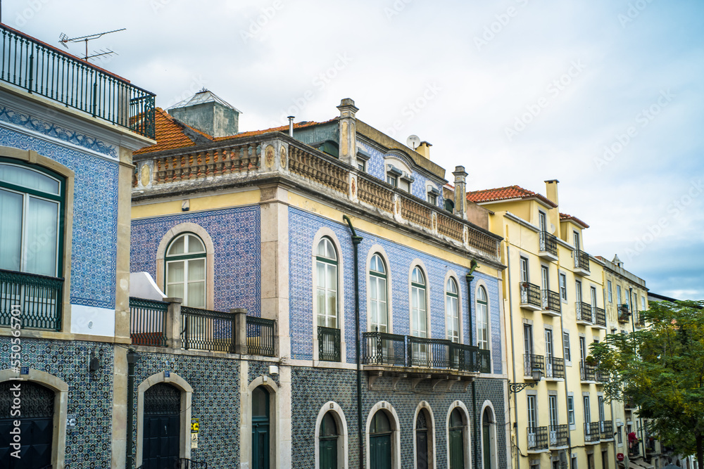 historic buildings of the old town of lisbon. Old colorful buildings, narrow streets, historic churches. Cloudy day