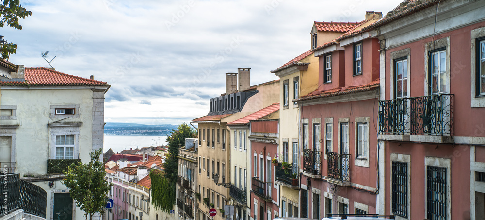 historic buildings of the old town of lisbon. Old colorful buildings, narrow streets, historic churches. Cloudy day
