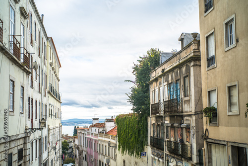 historic buildings of the old town of lisbon. Old colorful buildings, narrow streets, historic churches. Cloudy day © Piotr