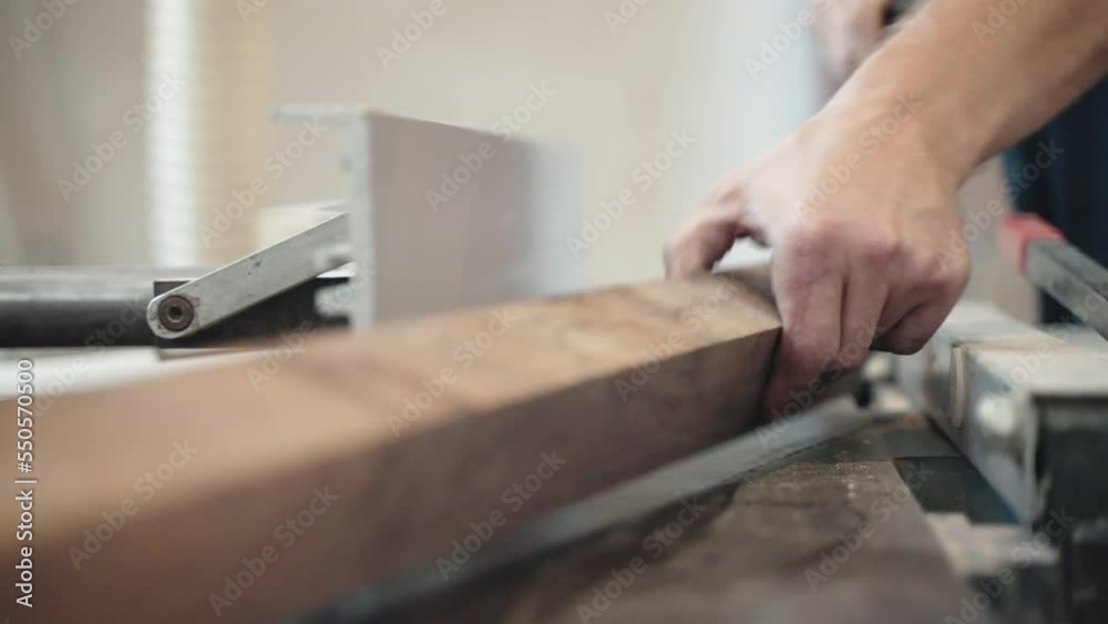 Wood sanding process in workshop, carpenter polishing plank surface with grinding machine preparing timber for further processing. Craftsman working with wood, high quality material processing Wood sanding process in workshop, carpenter polishing plank surface with grinding machine preparing timber for further processing. Craftsman working with wood, high quality material processing