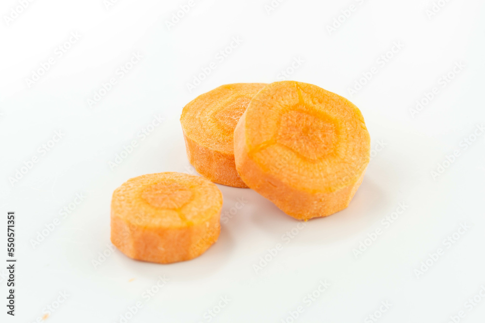 raw carrot slices isolated on white background raw carrot slices isolated on white background