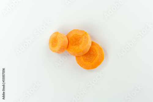 raw carrot slices isolated on white background