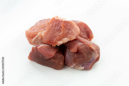 fresh raw meat cubes isolated on a white bacground