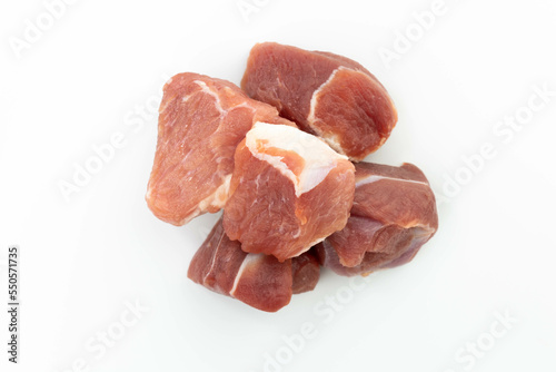 fresh raw meat cubes isolated on a white bacground top view