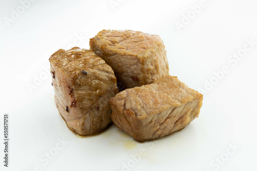fresh baked meat cubes isolated on a white bacground