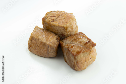 fresh baked meat cubes isolated on a white bacground