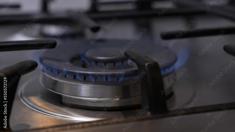 Close up natural gas stove burner flame. Gas hob / stove / cooker burning. Close up natural gas stove burner flame. Close up natural gas stove burner flame. Gas hob / stove / cooker burning. Close up natural gas stove burner flame.
