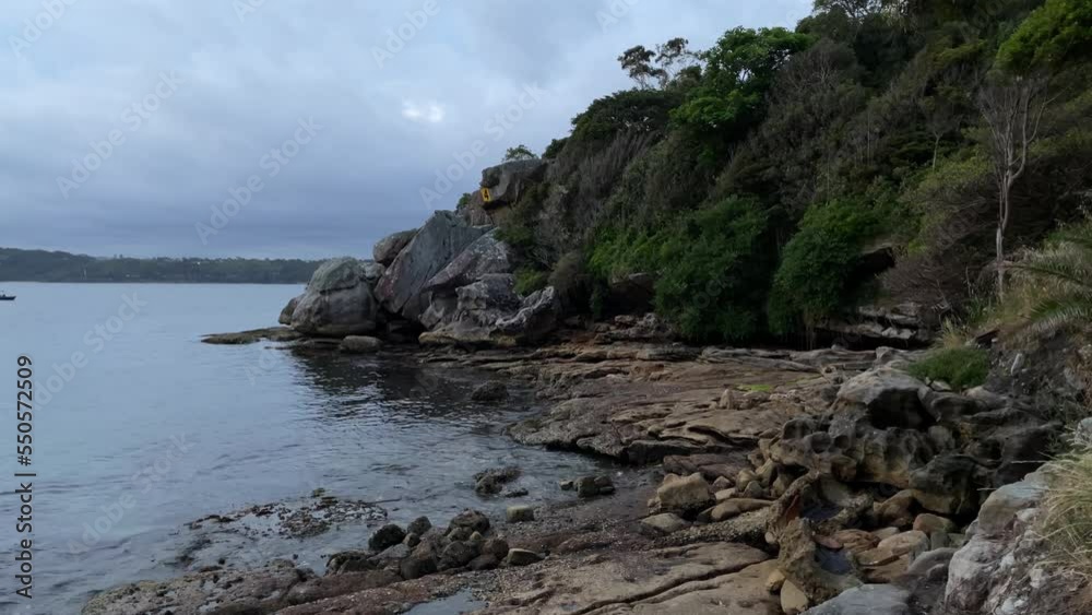 Rocky coastline view with cloudy sky. Rocky coastline view with cloudy sky.