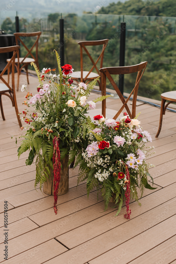 Fototapeta premium Beautiful bouquets and flower combinations for aisle decoration and special events like wedding ceremony and reception.