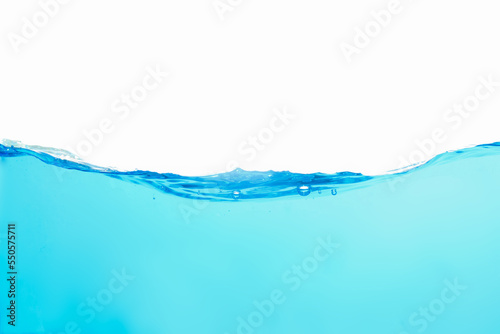 Light blue water splash with air bubbles isolated on clean white background, wave motion.