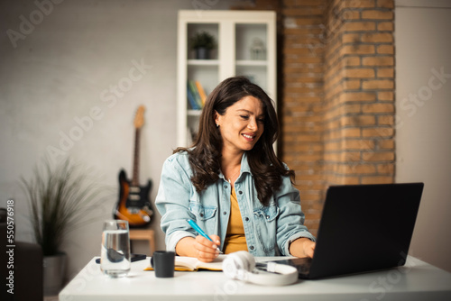 Pregnant woman in office. Beautiful businesswoman enjoy in fresh coffee. © JustLife