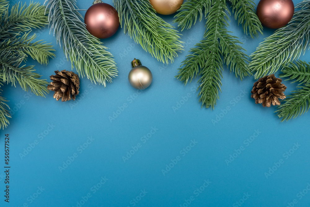 Christmas composition. festive decor on blue background. Copy space, flat lay, top view.