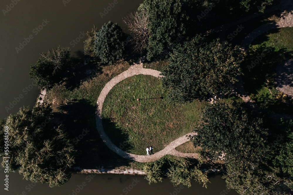 Top view of a couple of people, a couple in love walking in the park.