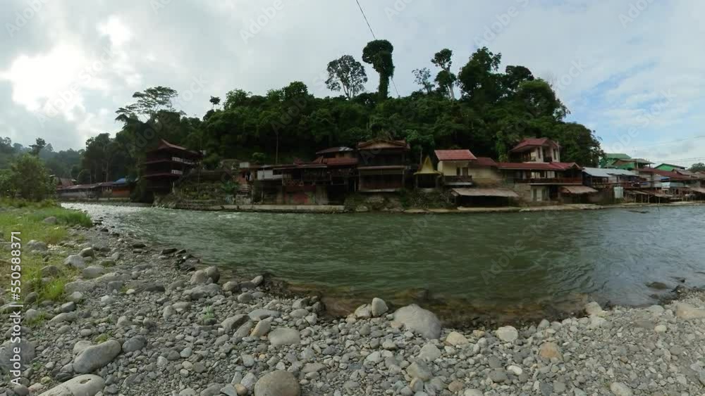 Sumatra, Indonesia - Sep 8, 2022: River in a the Jungle Village of Bukit Lawang. Sumatra, Indonesia - Sep 8, 2022: River in a the Jungle Village of Bukit Lawang.