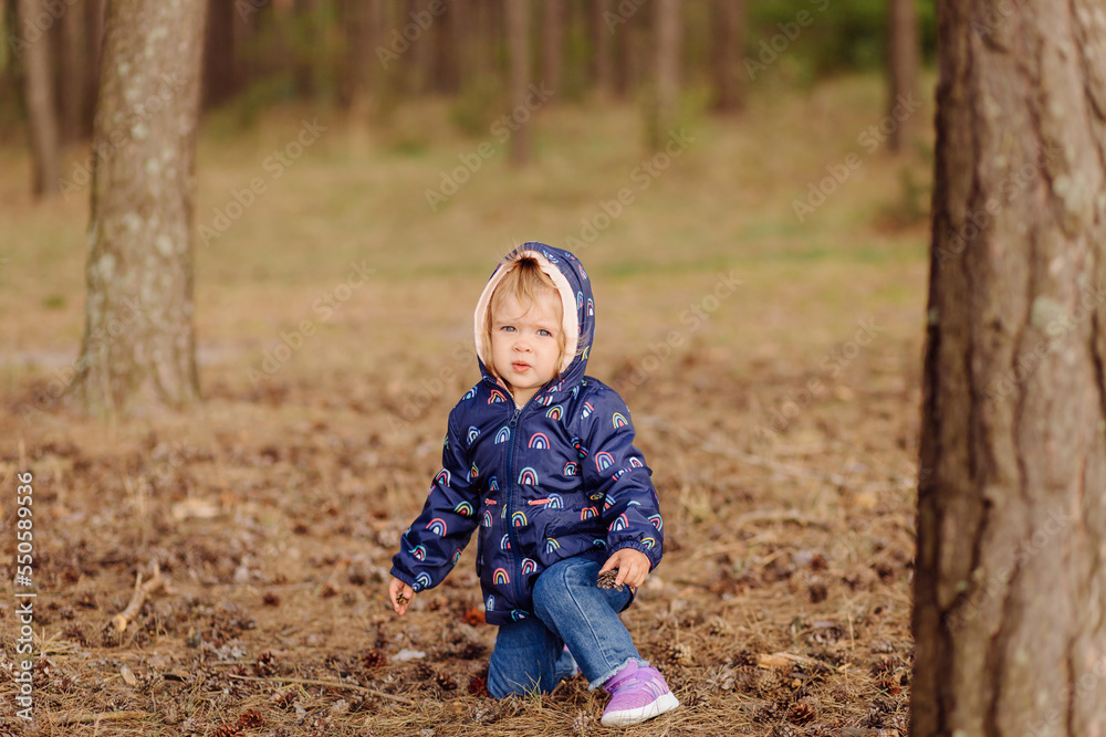 little girl in the forest. On a forest road among the pines. little girl in the forest. On a forest road among the pines.