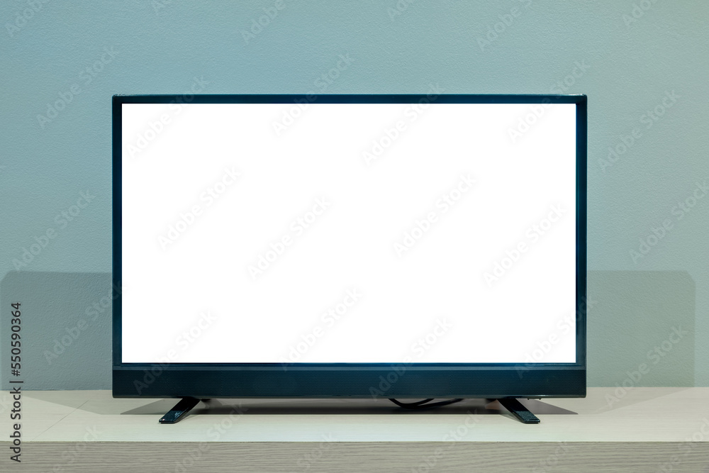 Flat LCD television on wood table in the living room with dark gray wall Flat LCD television on wood table in the living room with dark gray wall