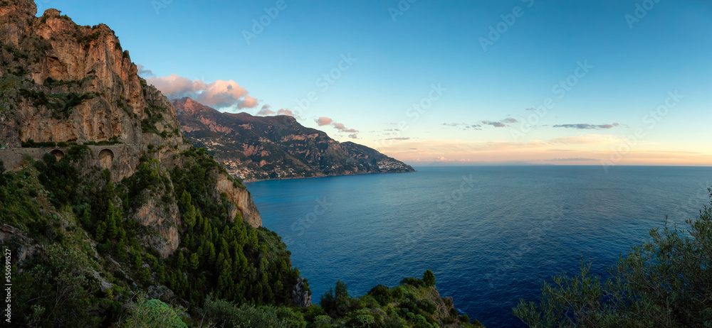 Touristic Town, Positano, on Rocky Cliffs and Mountain Landscape by the Tyrrhenian Sea. Amalfi Coast, Italy. Sunset Sky Panorama