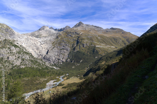 View of famous Rhone Glacier with Rhone River in the Swiss Alps with glacier river on a sunny late summer day. Photo taken September 12th, 2022, Furka Pass, Switzerland.