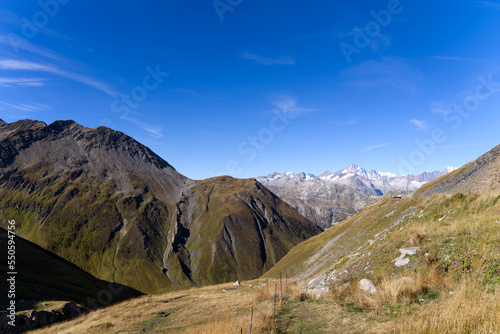 Scenic view of famous Swiss mountain pass Furkapass with rocks and mountain peak on a sunny late summer day. Photo taken September 12th, 2022, Furka Pass, Switzerland.