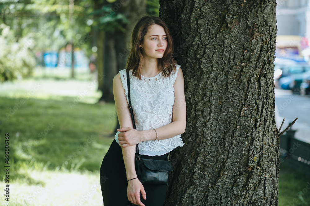 Beautiful young girl smiling in the park. healthy new life image Beautiful young girl smiling in the park. healthy new life image