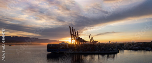 Panoramic skyline view of Vancouver international industrial port with freight and shipment docks.