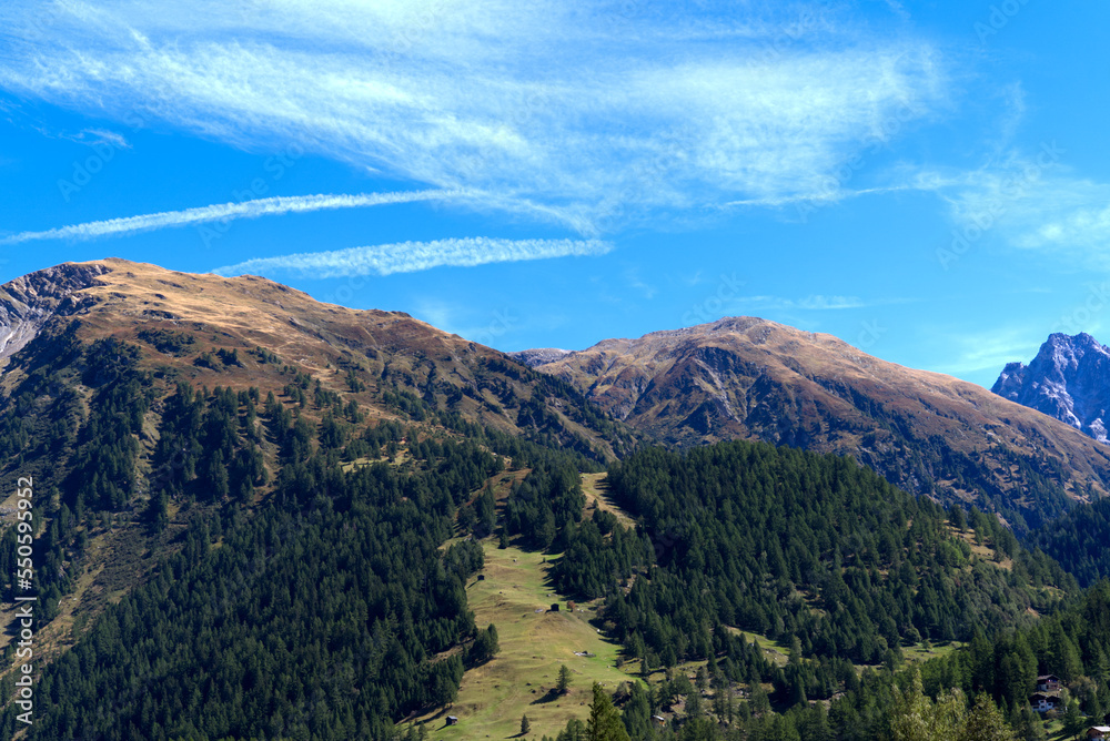 Scenic view of mountain panorama seen from mountain village Oberwald, Canton Valais, on a sunny late summer day. Photo taken September 12th, 2022, Oberwald, Switzerland.