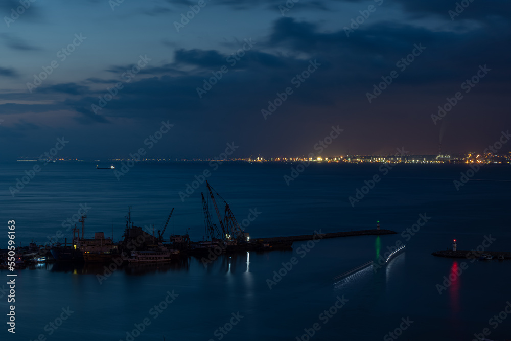 Fishing boats in Iskenderun harbor at dusk.